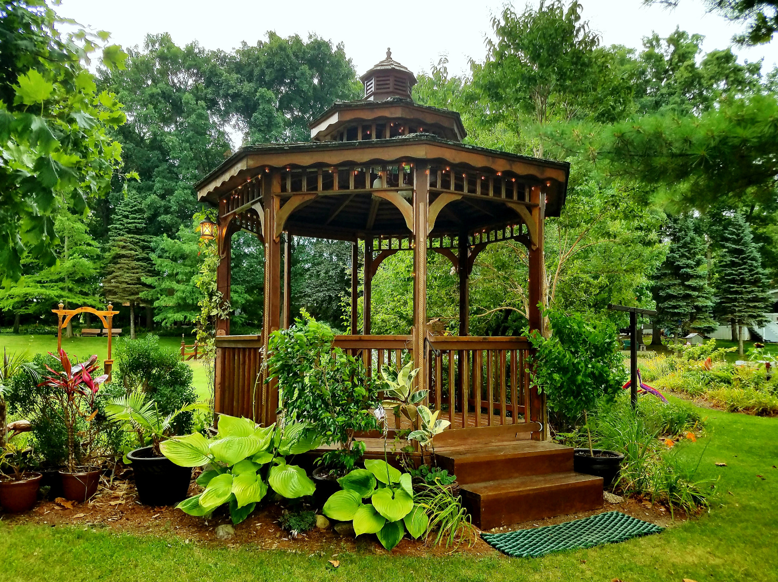Backside of Cedar Gazebo shows rear exit gate