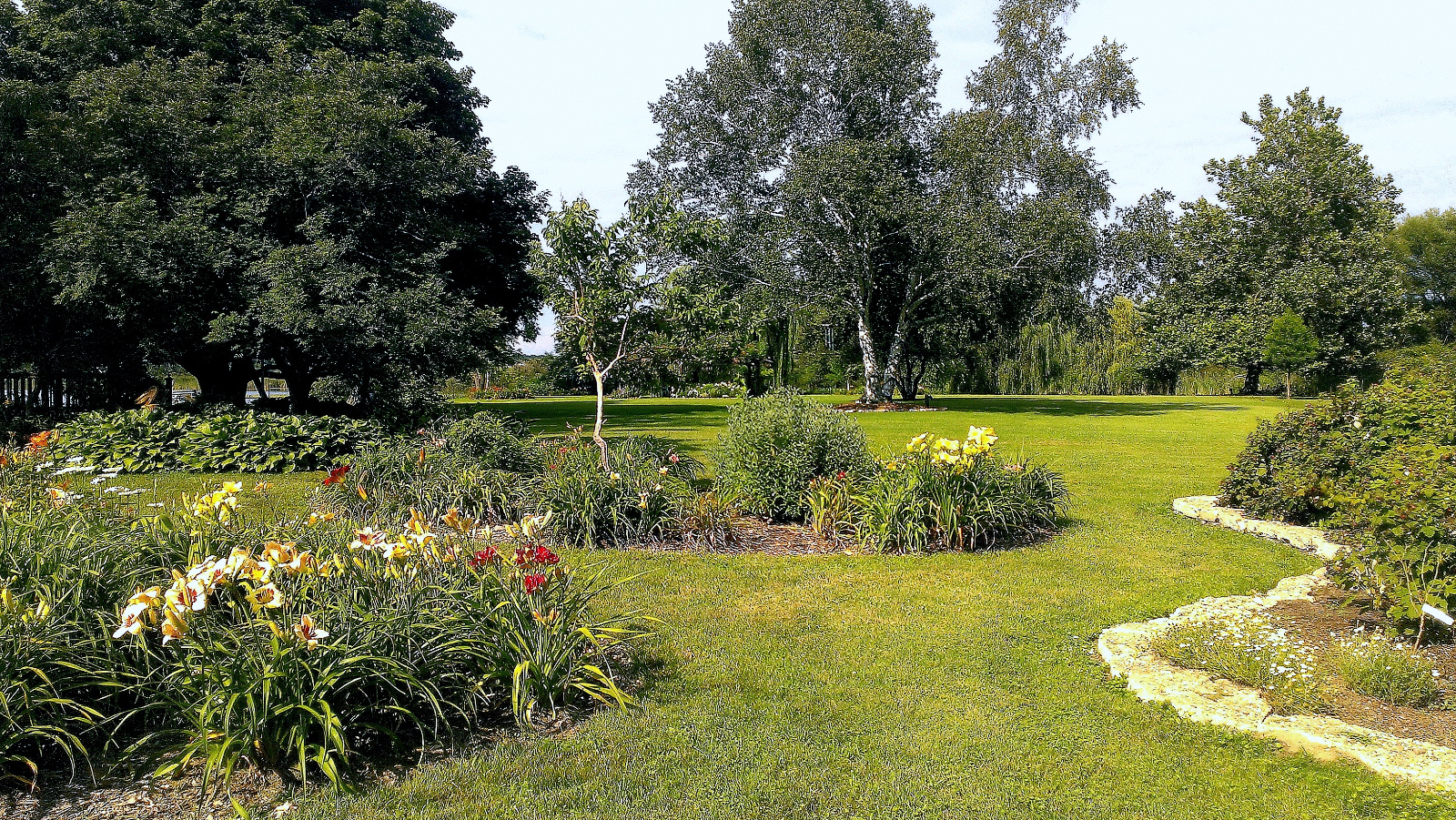 Daylily flowerbeds and a look across the Island towards Flowering Gazebo